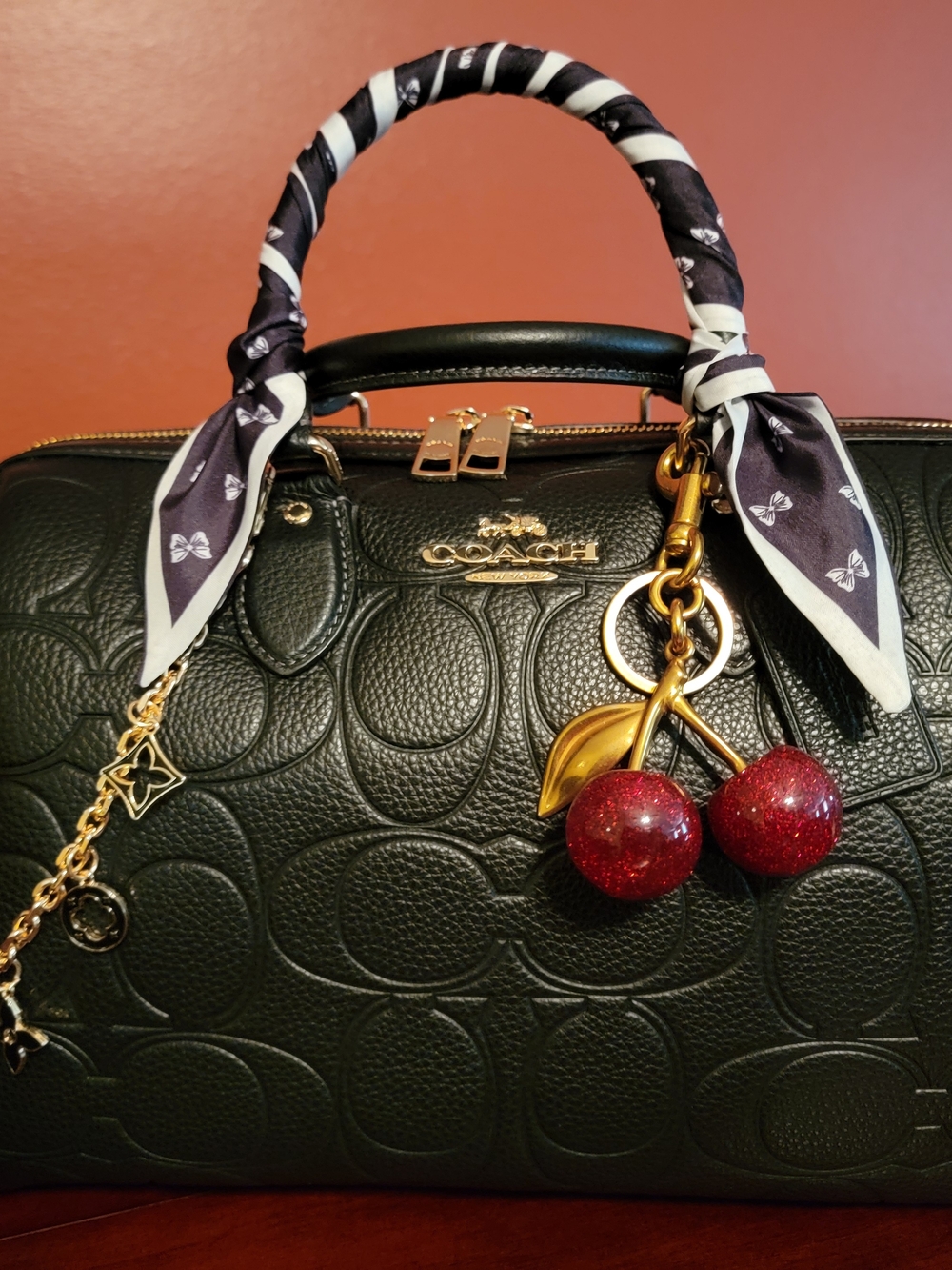 COACH Black Rowan Large Leather Signature Satchel with Red Cherry Charm